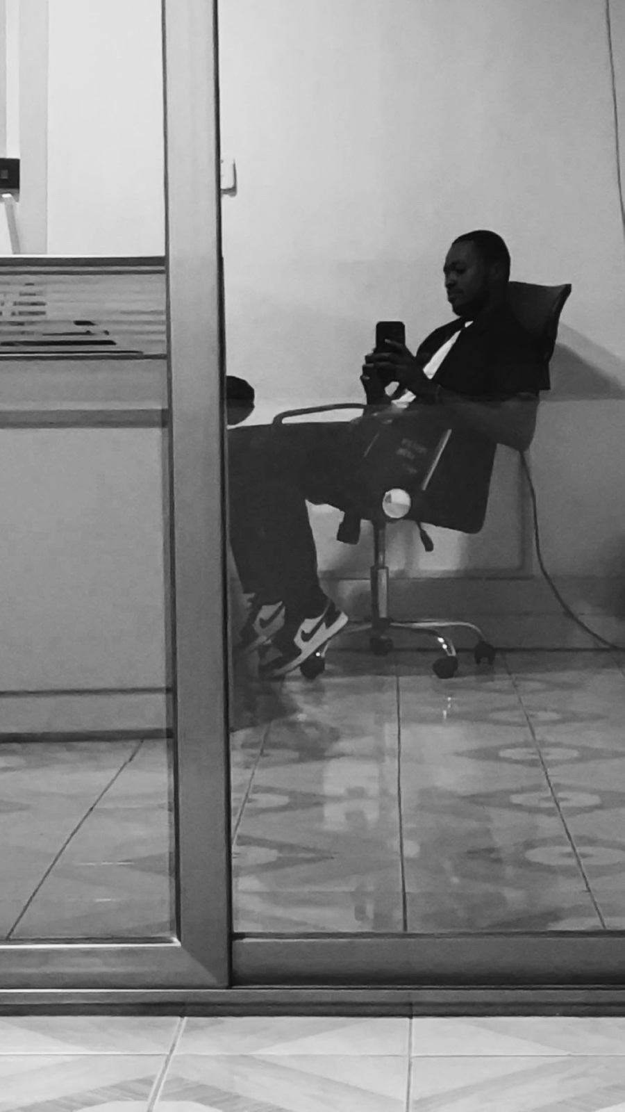 Gerald taking a quiet moment in an office chair.